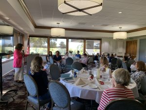 September 11, 2024 Day meeting - ladies at lunch tables listening to speaker