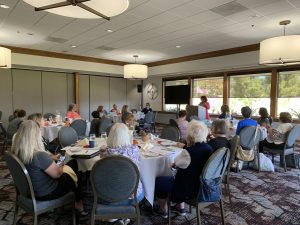 September 11, 2024 Day meeting - ladies at lunch tables listening to speaker