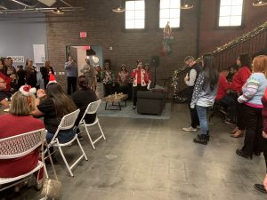 Rachel Beld announcing at mixer