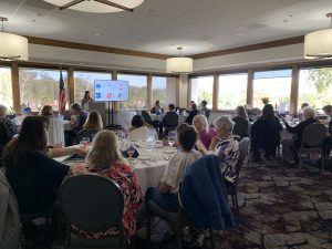 Jess at the podium explaining Donation Day procedures.