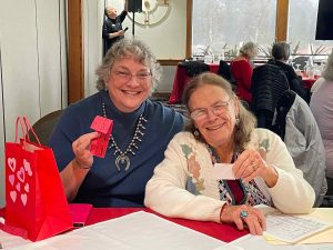 Tenaya at Raffle duty and Nancy at check-in