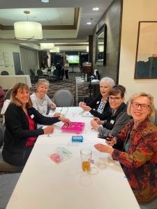 Making Swift bracelets for autism walk at WCV at night meeting