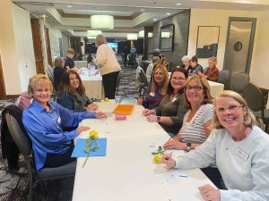 Making Swift bracelets for autism walk at WCV at night meeting