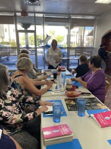 Liz making announcements at the May Book Club