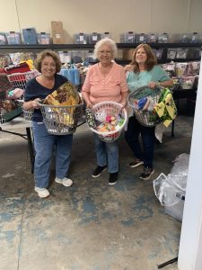 Donna, Anna Marie, and Liz with sorted items