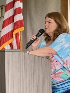 Prez Liz at the podium