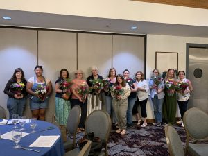 Group pic with their flower arrangements