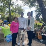 Belle Mente Academy representative receiving donation