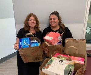 Liz and Sierra with plenty of feminine products for the teen girls